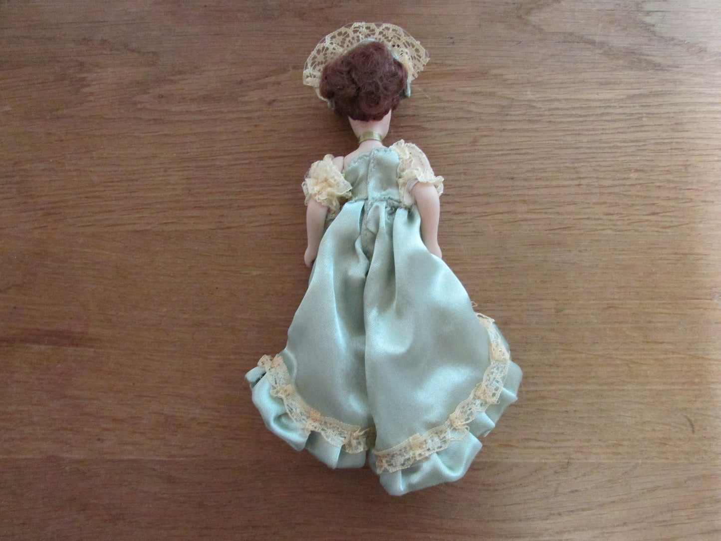 Vintage miniature porcelain doll's house doll in traditional Victorian dress