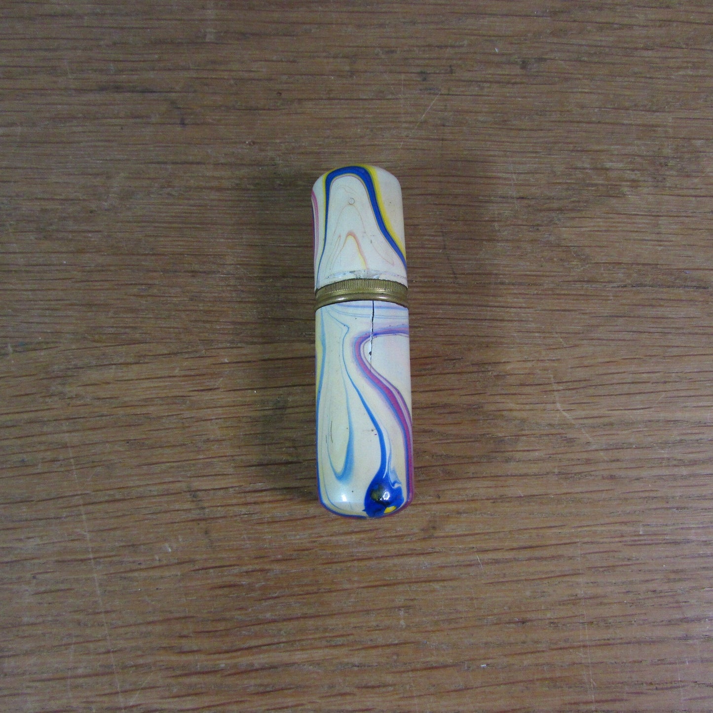 Art Deco marbled brass etui case containing wooden needle holder/thread spool