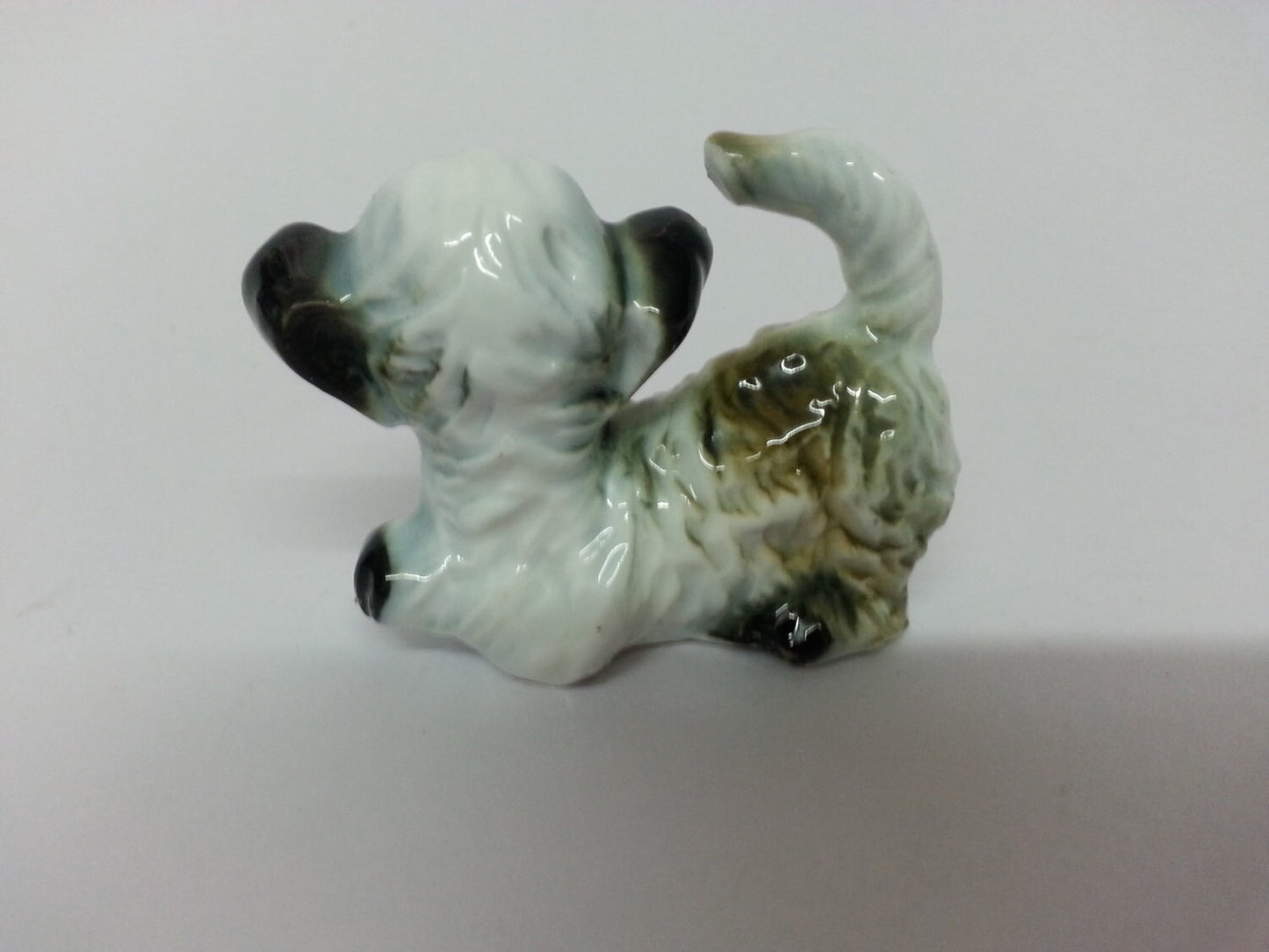 Vintage china Schnauzer dog, wagging tail
