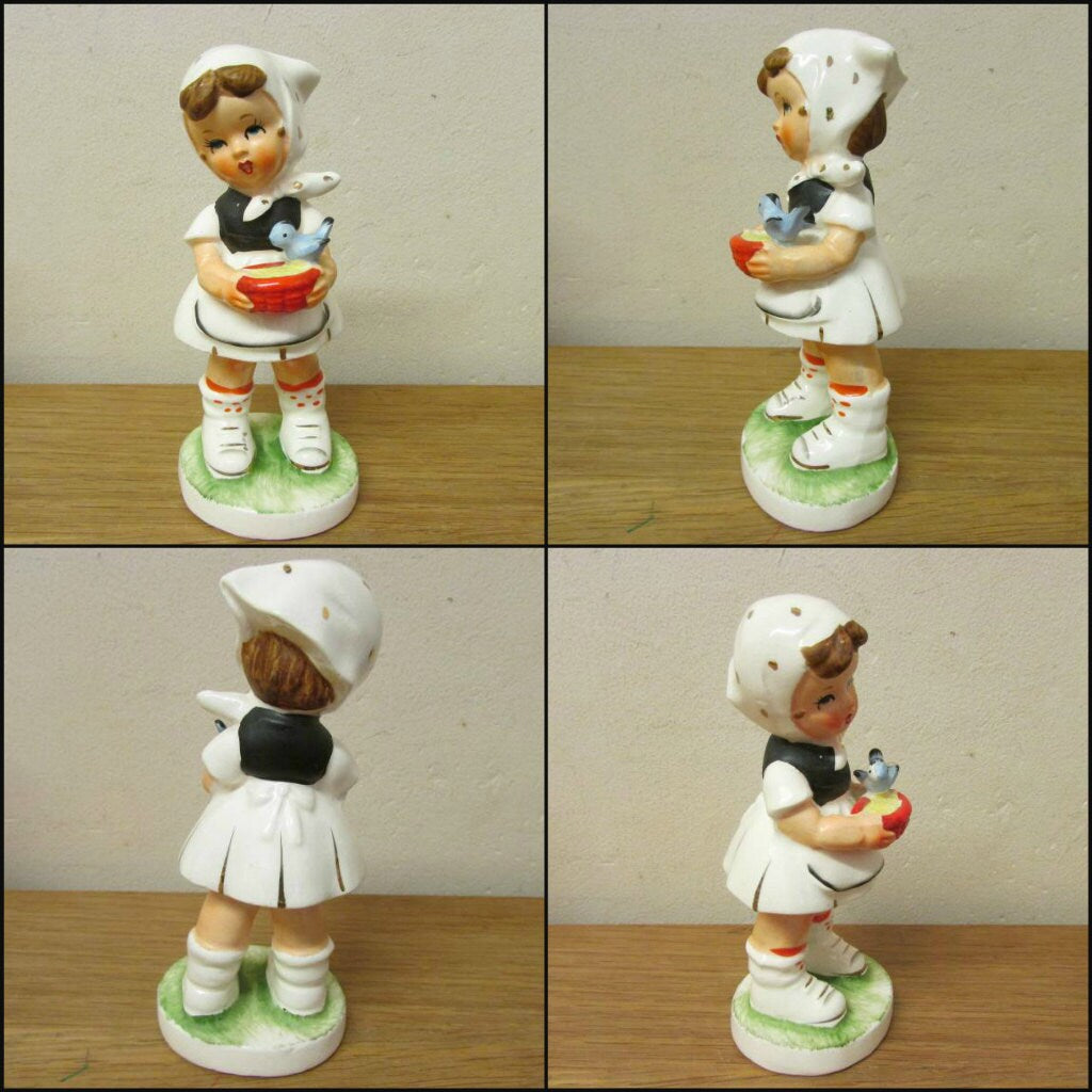 Set of four vintage Hummel-style ceramic figurines