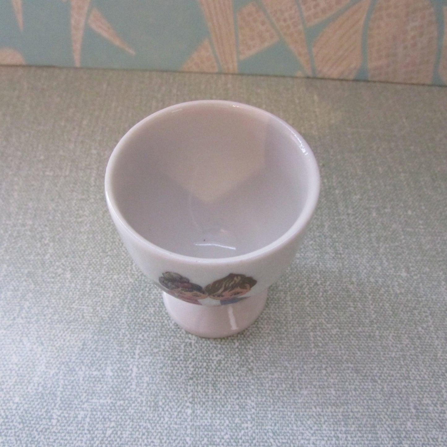1970s retro egg cup, cute illustration of boy & girl amongst flowers