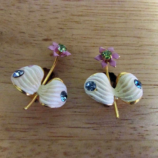 1950s Elizabeth Creations cream enamel floral clip-on earrings with blue rhinestones