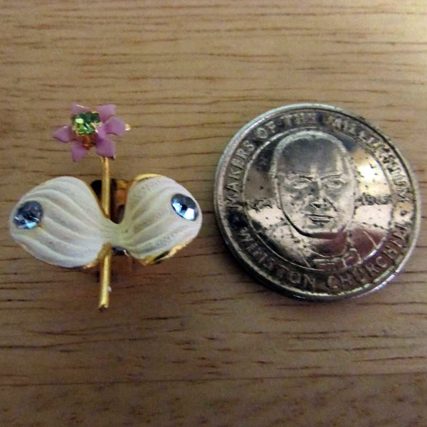 1950s Elizabeth Creations cream enamel floral clip-on earrings with blue rhinestones