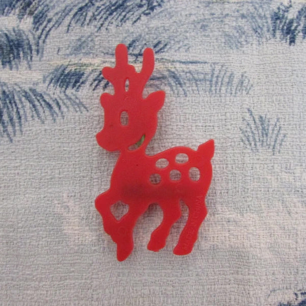 Kitsch home-made brooch using vintage red plastic deer cake topper