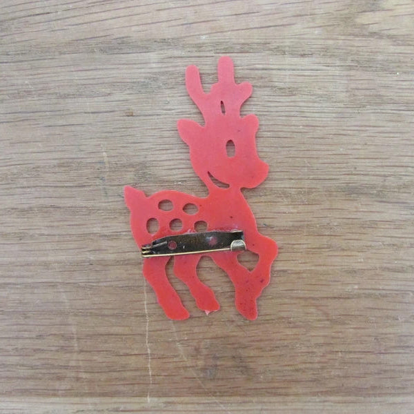 Kitsch home-made brooch using vintage red plastic deer cake topper