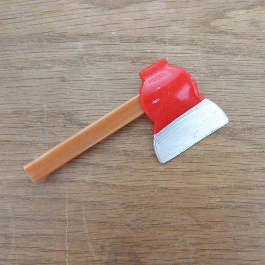 Kitsch home-made brooch using vintage plastic hatchet/axe cake topper