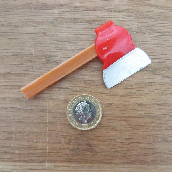 Kitsch home-made brooch using vintage plastic hatchet/axe cake topper