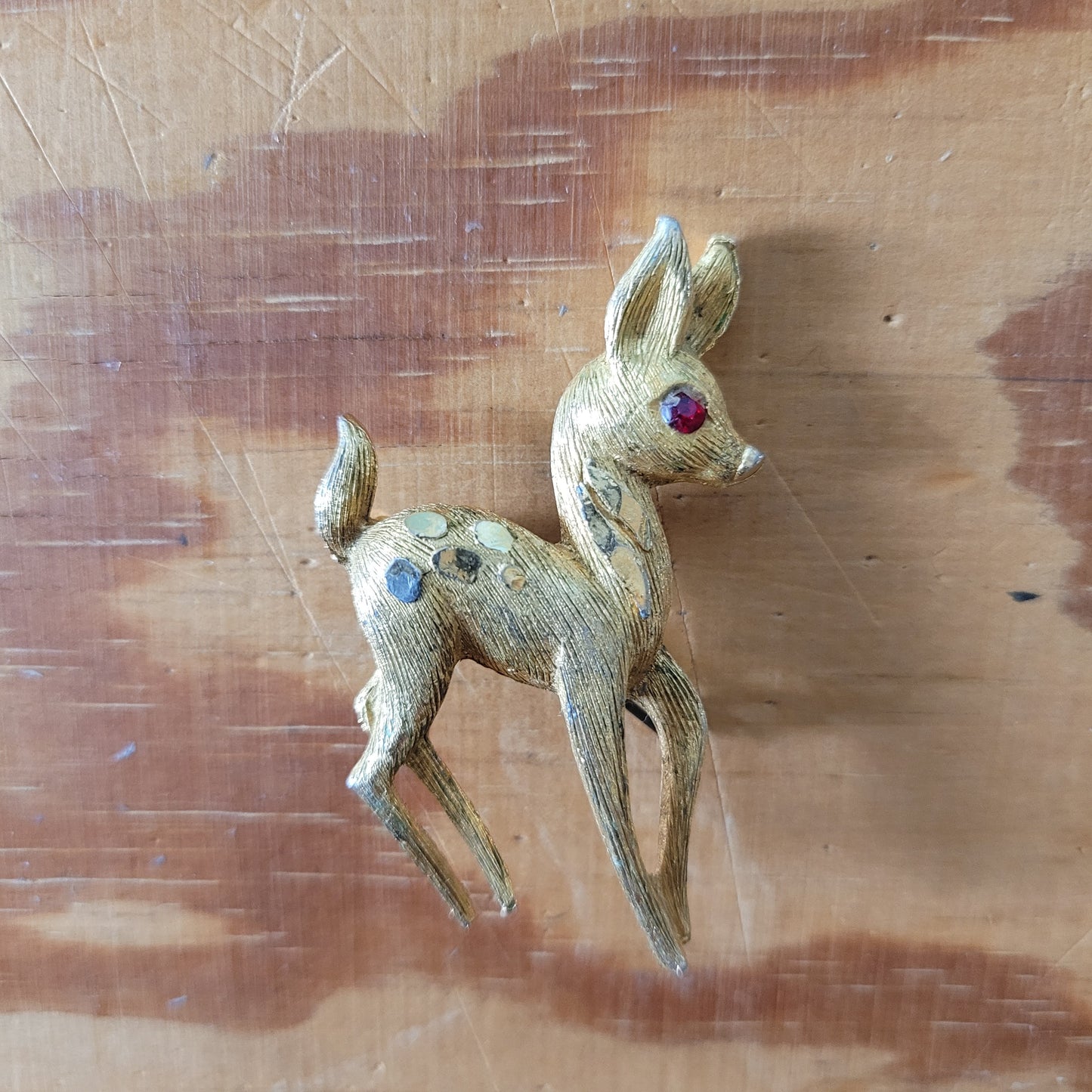 1950s gold-tone fawn brooch with red rhinestone eye