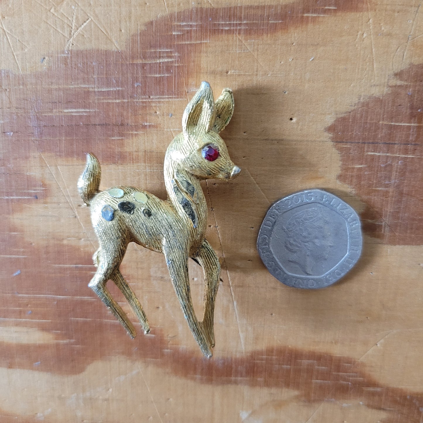 1950s gold-tone fawn brooch with red rhinestone eye