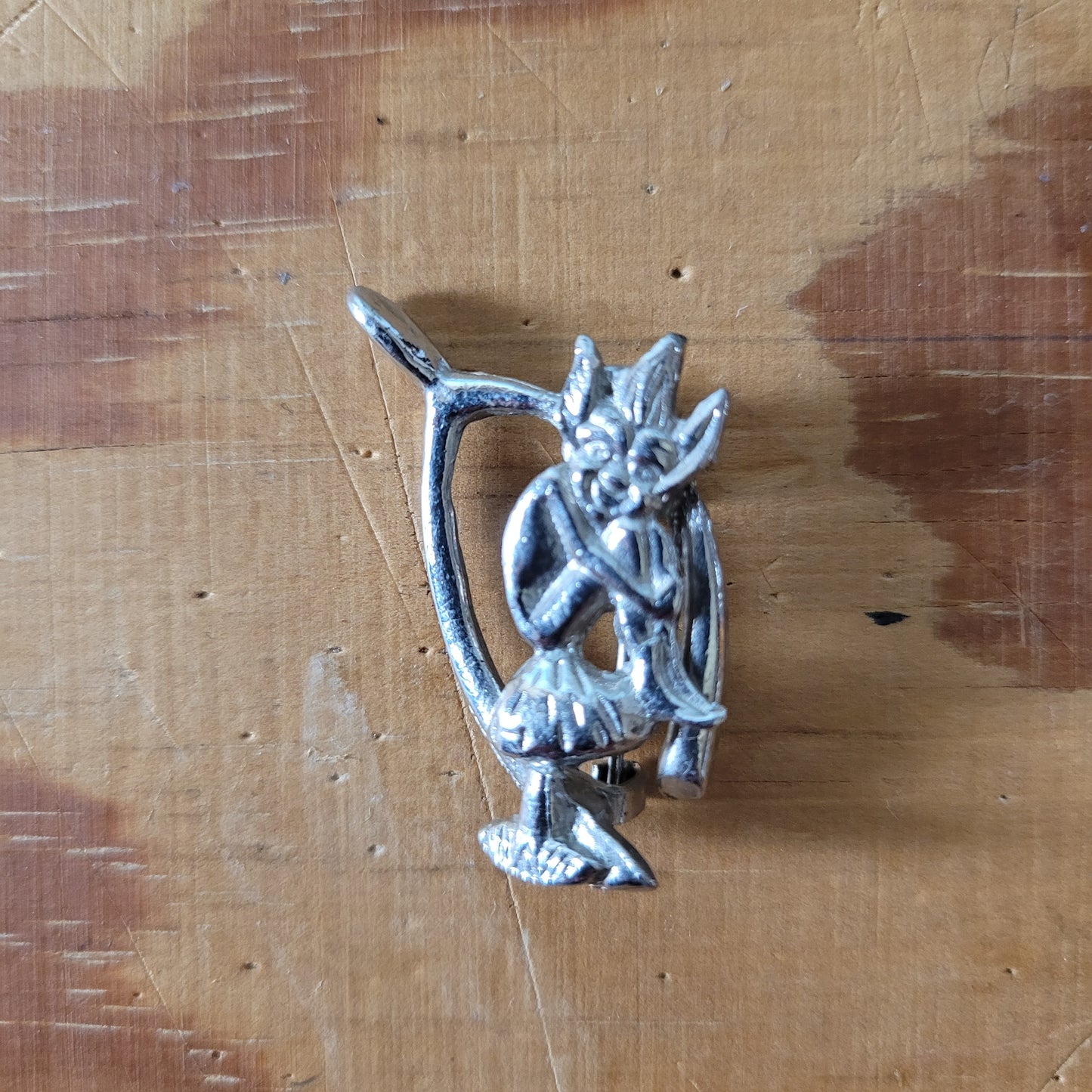 Vintage Hollywood silver-tone wishbone & pixie brooch