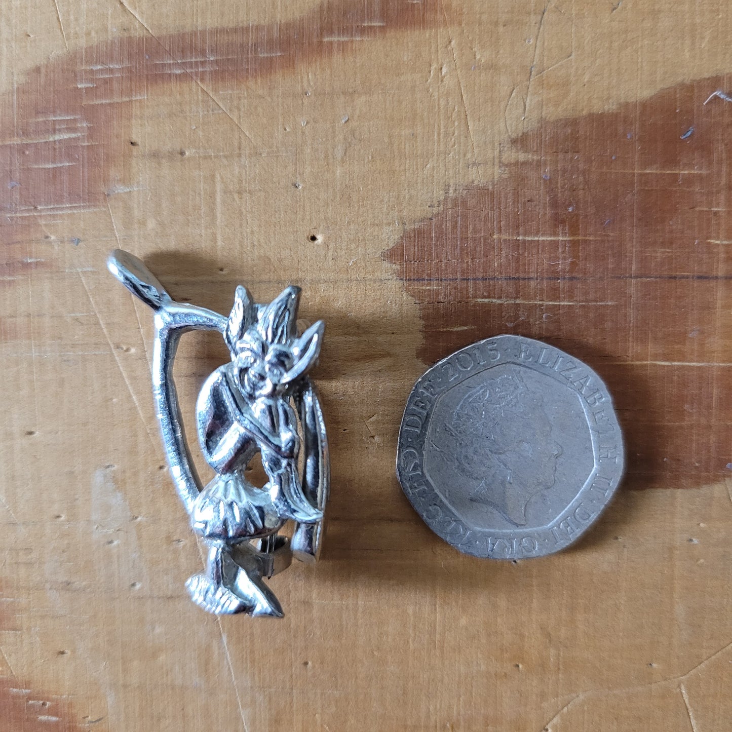 Vintage Hollywood silver-tone wishbone & pixie brooch