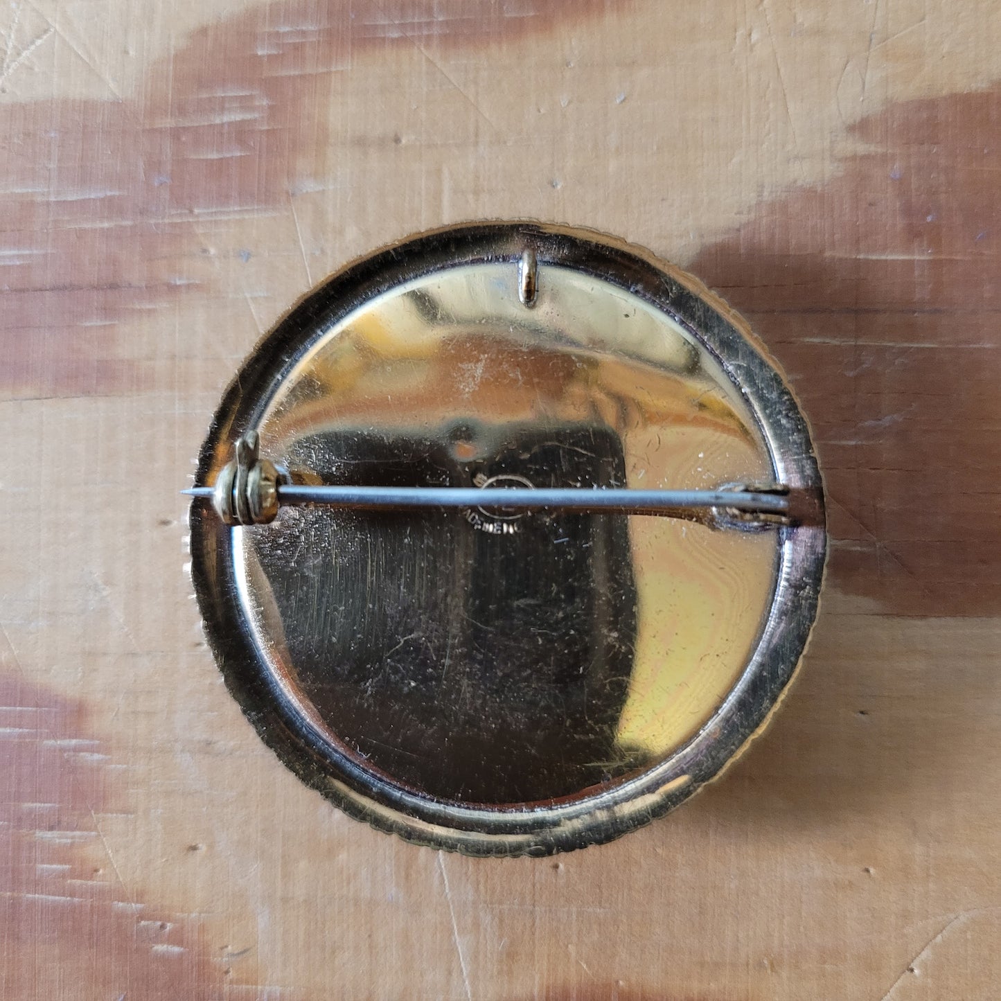 Vintage gold-tone painted butterfly wing brooch/pendant, detailing sailing boat & palm tree