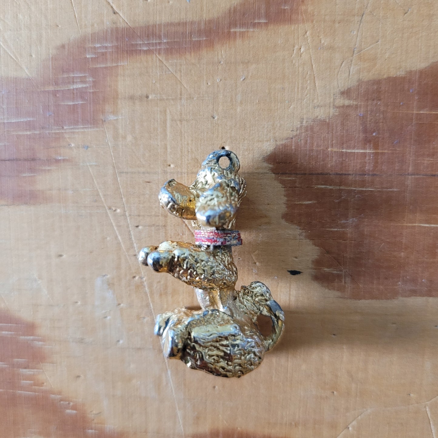 Vintage gold-tone begging French poodle pendant with red collar