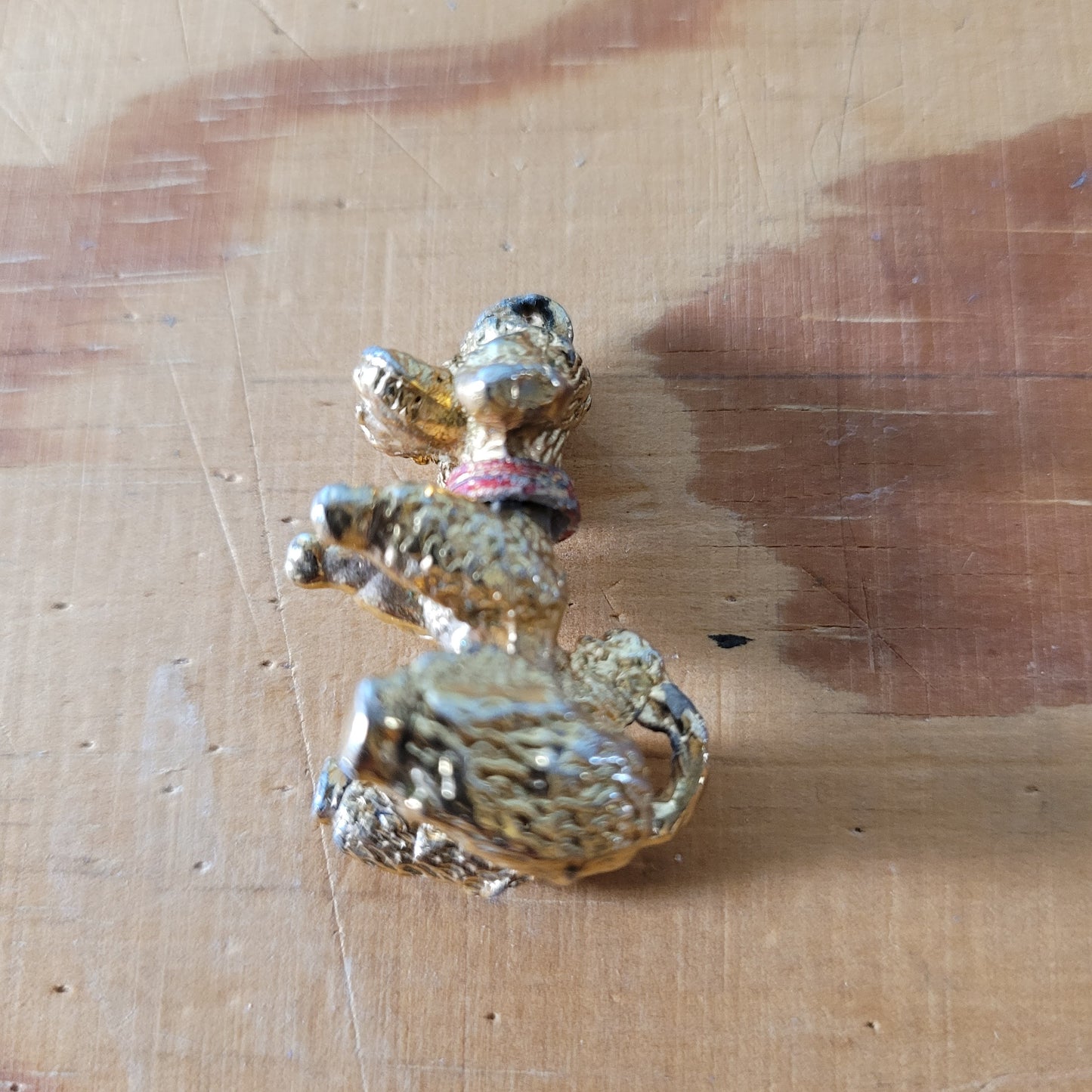Vintage gold-tone begging French poodle pendant with red collar