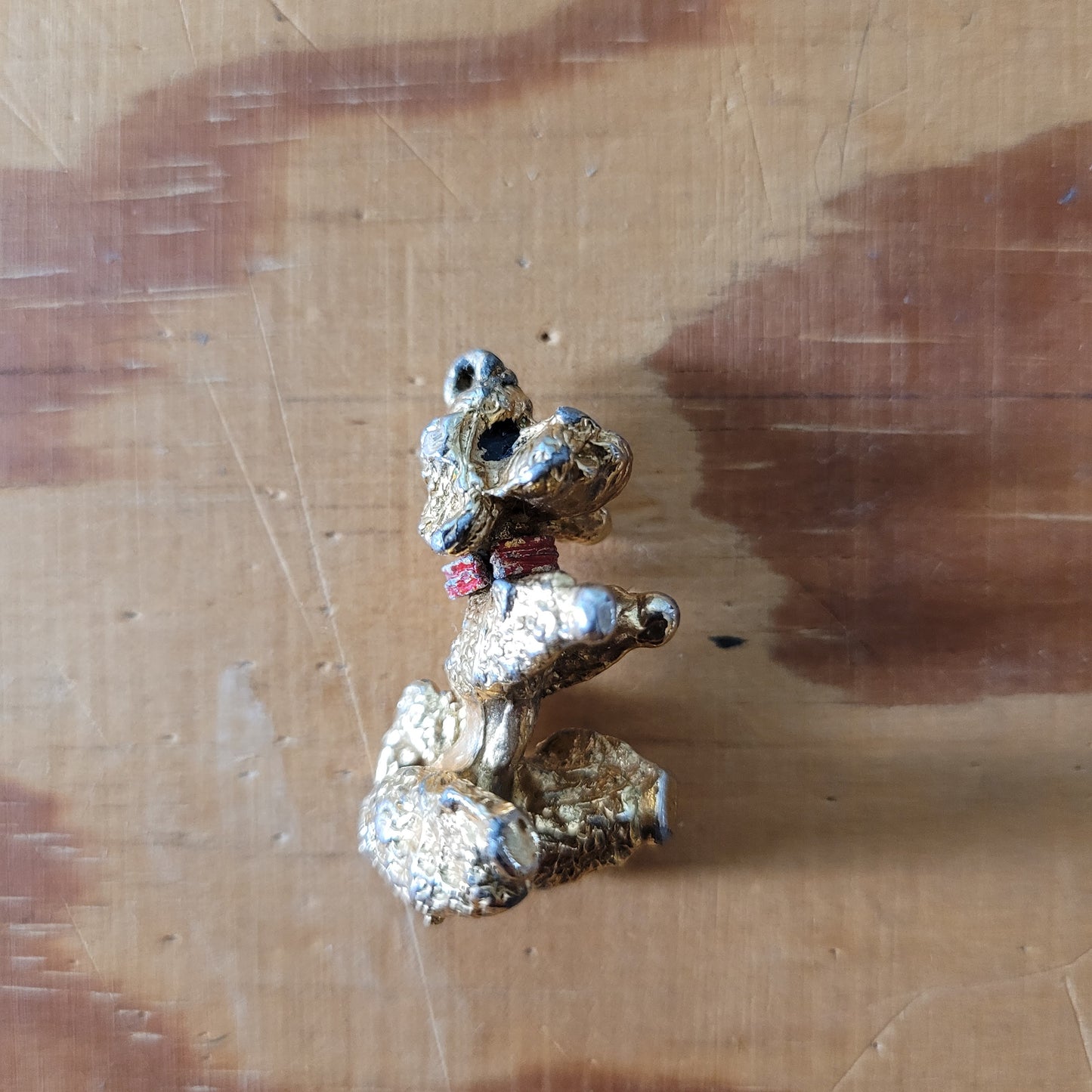 Vintage gold-tone begging French poodle pendant with red collar