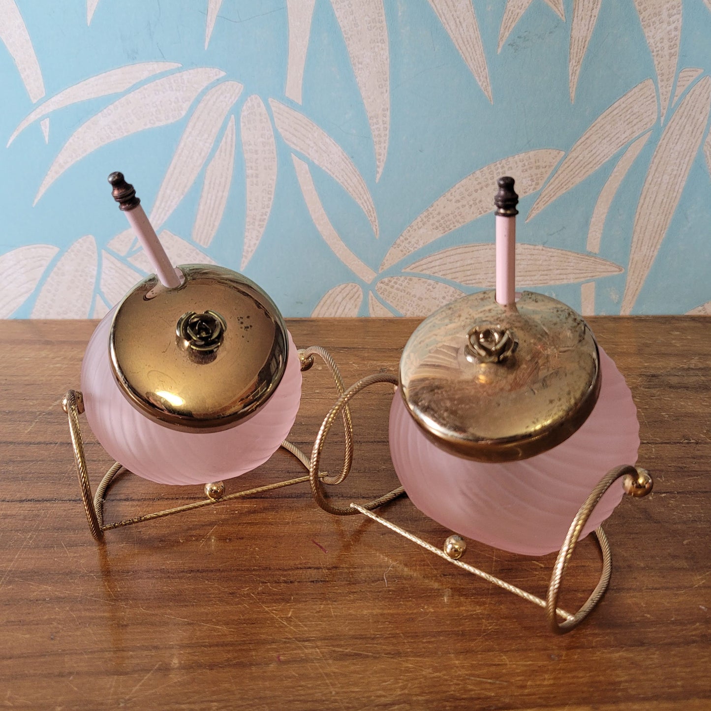 Pair of rare 1970s rose pink glass preserve jars with gold-tone stands & lids