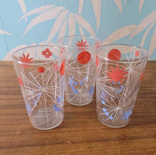 Three 1950s atomic starburst patterned glass tumblers
