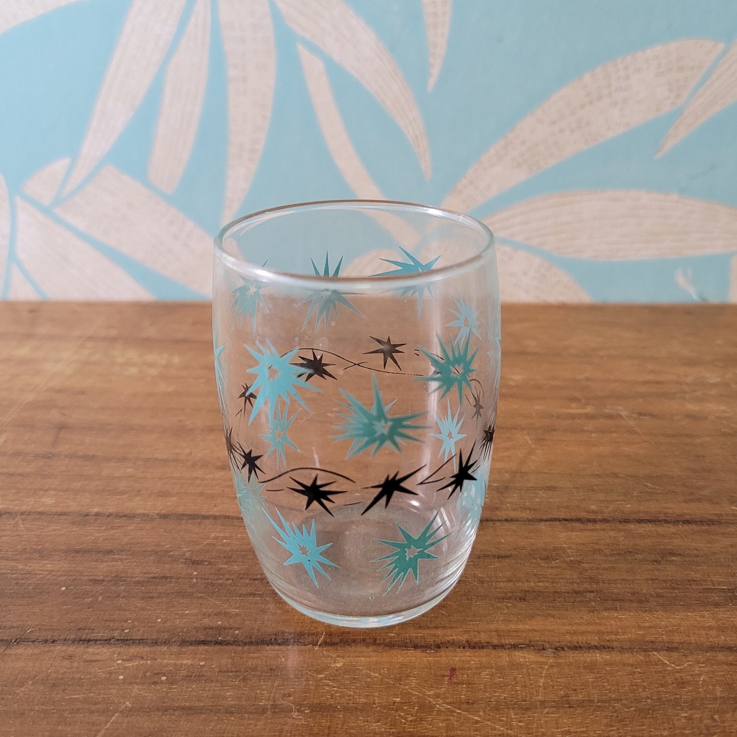 Two 1950s/60s yellow/black, & turquoise/black atomic starburst juice glasses