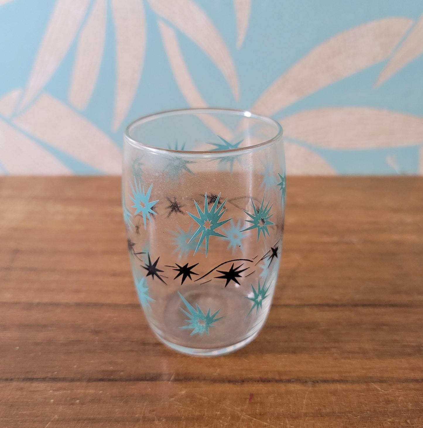 Two 1950s/60s yellow/black, & turquoise/black atomic starburst juice glasses