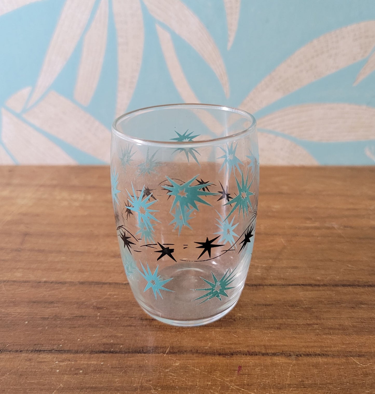 Two 1950s/60s yellow/black, & turquoise/black atomic starburst juice glasses