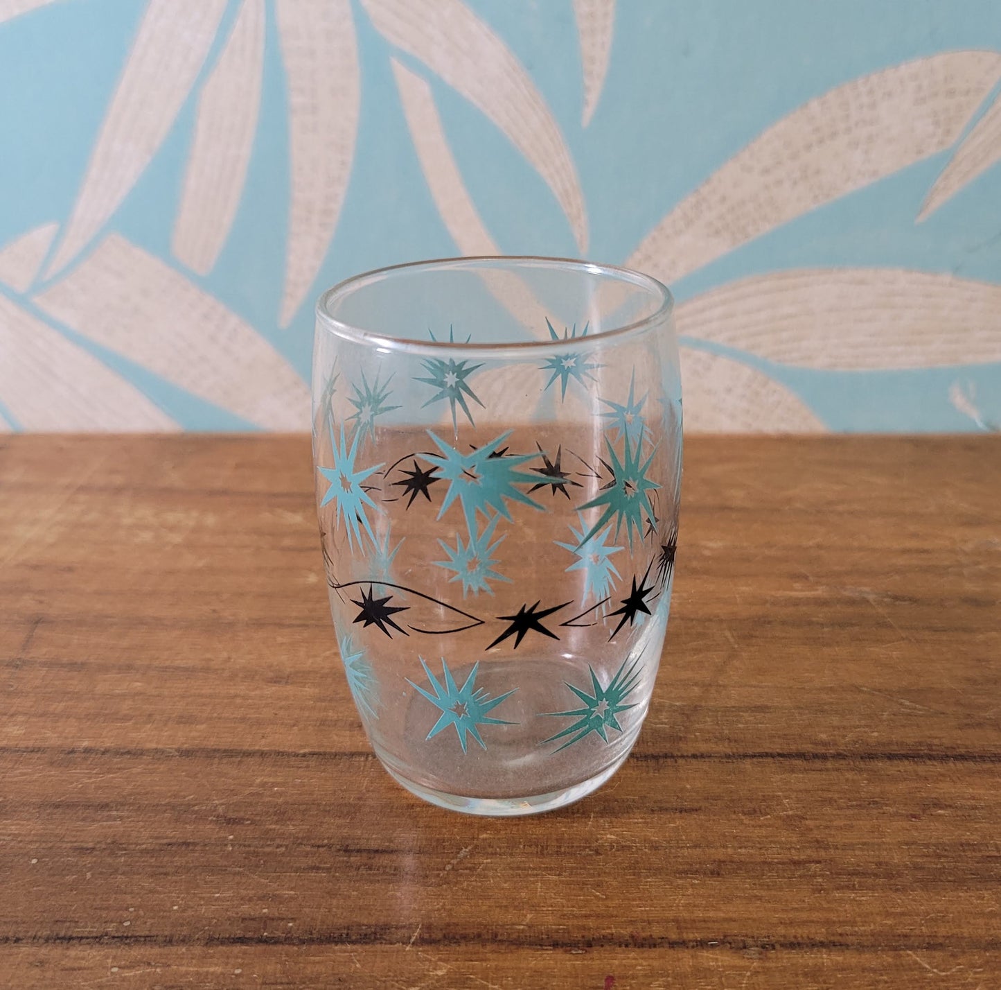 Two 1950s/60s yellow/black, & turquoise/black atomic starburst juice glasses