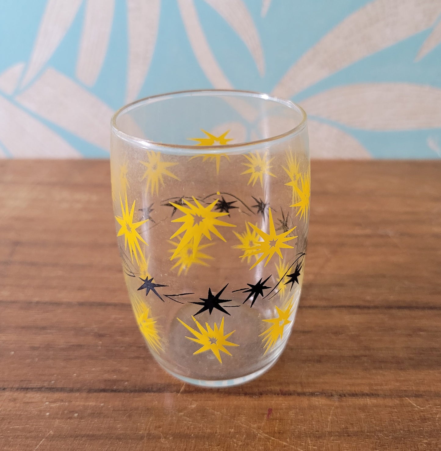 Two 1950s/60s yellow/black, & turquoise/black atomic starburst juice glasses