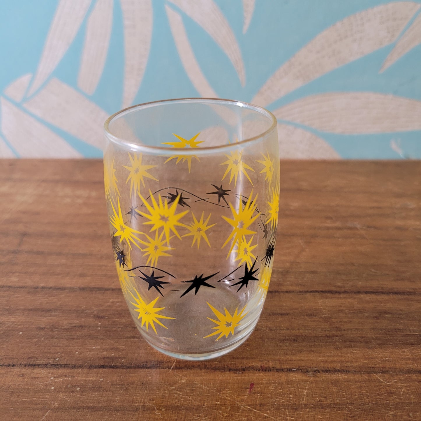 Two 1950s/60s yellow/black, & turquoise/black atomic starburst juice glasses