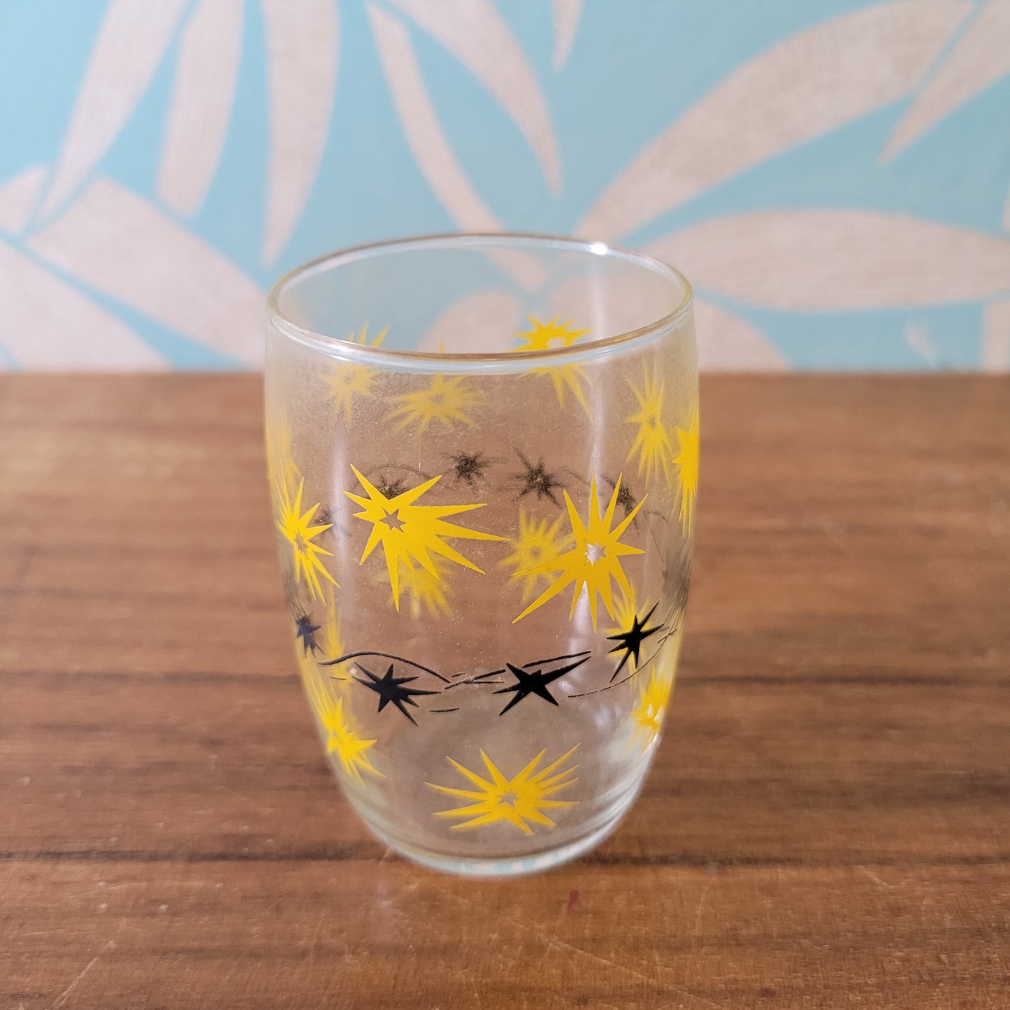 Two 1950s/60s yellow/black, & turquoise/black atomic starburst juice glasses