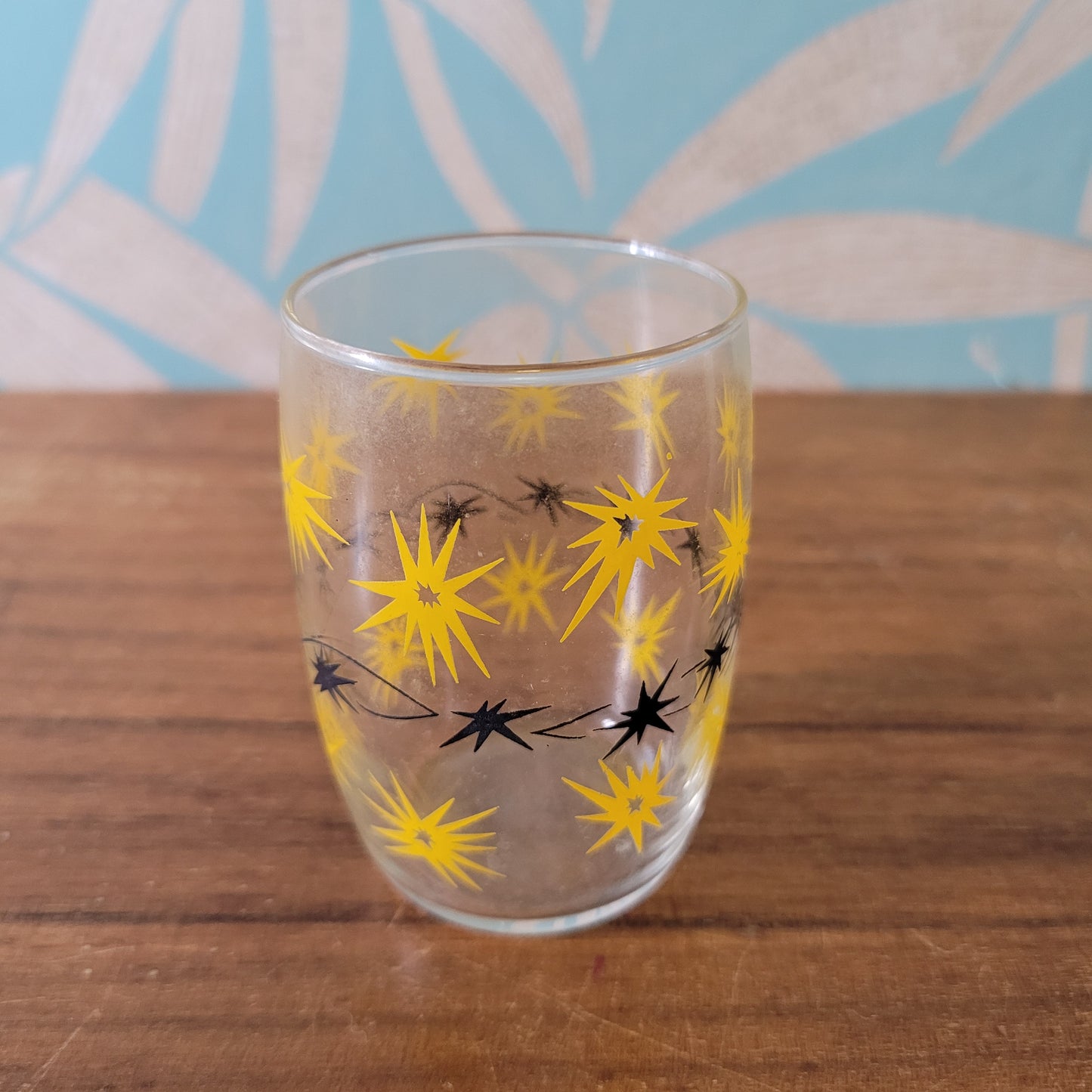 Two 1950s/60s yellow/black, & turquoise/black atomic starburst juice glasses