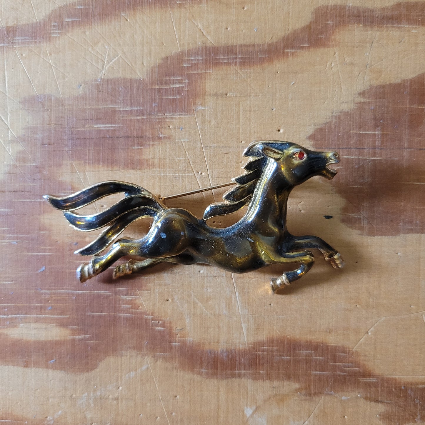 Vintage brown enamel galloping horse brooch