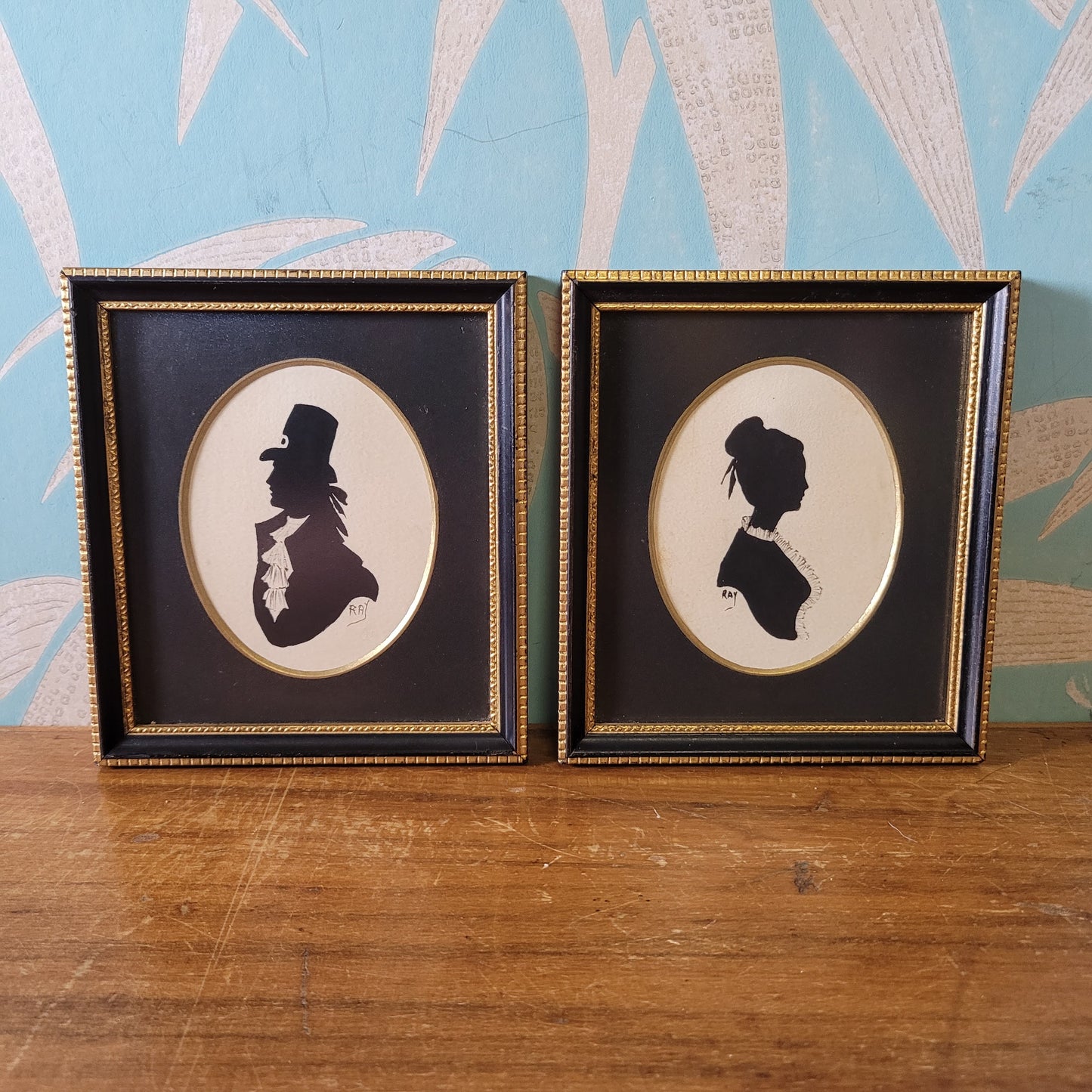 Two framed vintage, lady, and gentleman, bust silhouette portraits, signed RAY