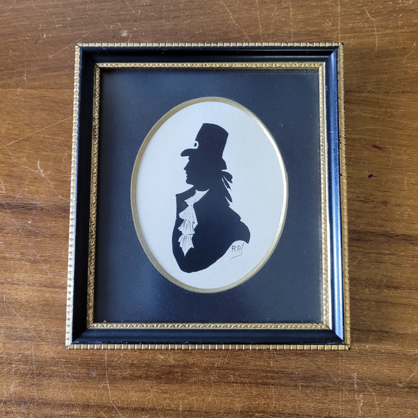 Two framed vintage, lady, and gentleman, bust silhouette portraits, signed RAY