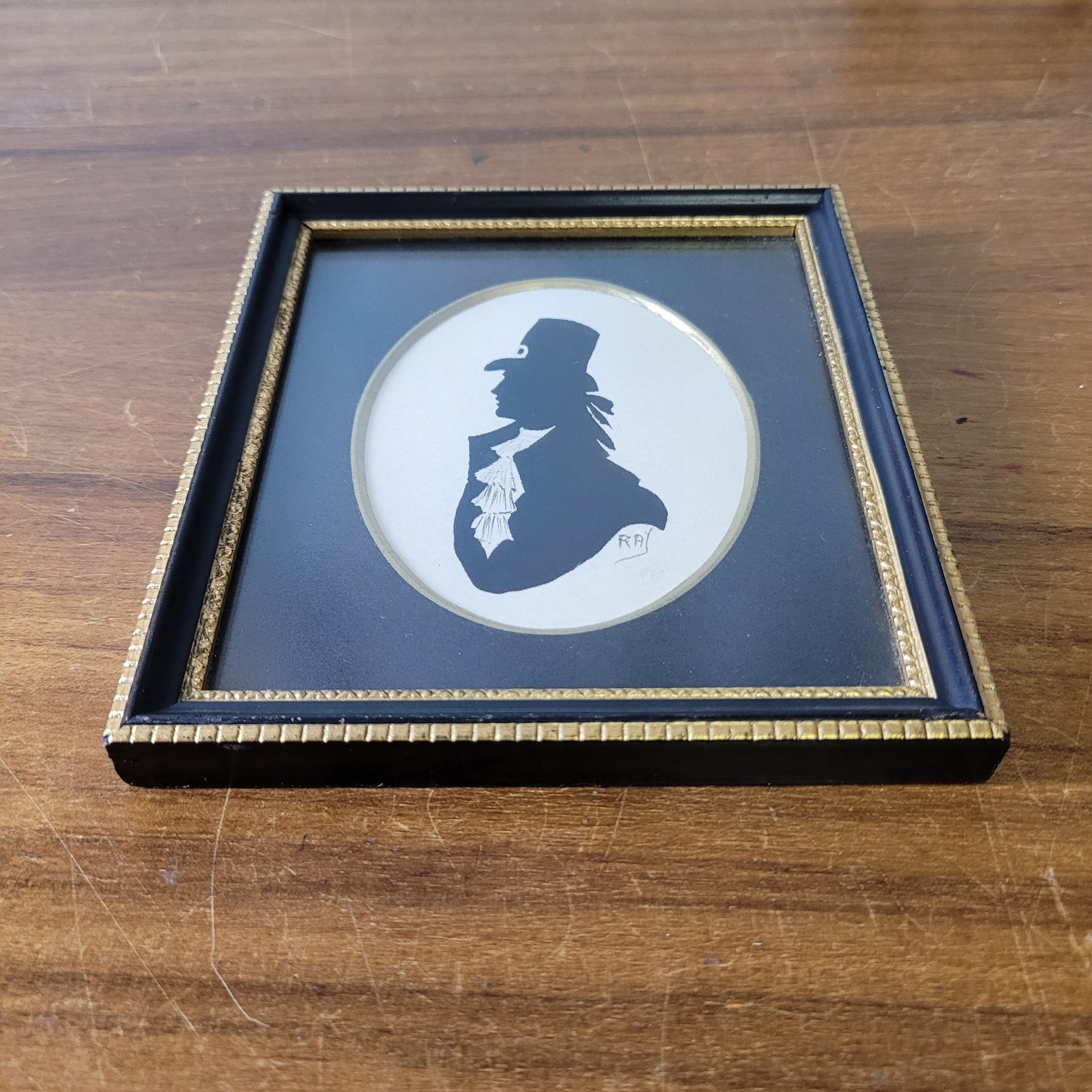 Two framed vintage, lady, and gentleman, bust silhouette portraits, signed RAY