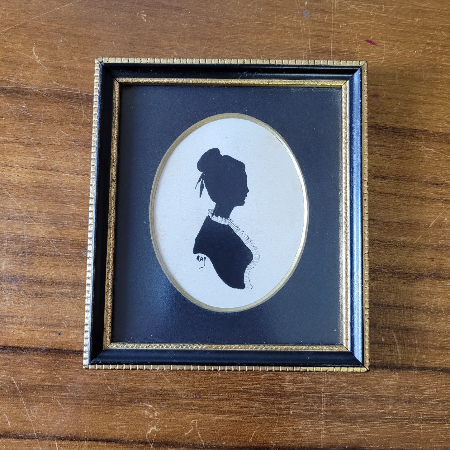 Two framed vintage, lady, and gentleman, bust silhouette portraits, signed RAY