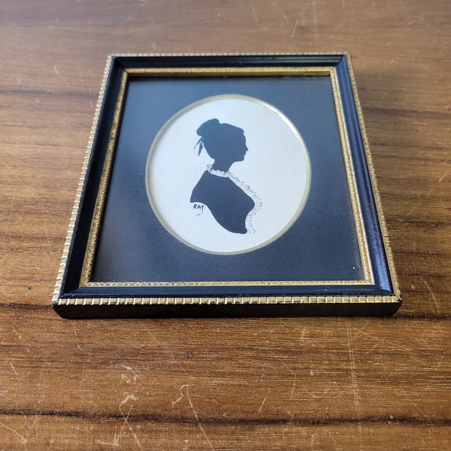 Two framed vintage, lady, and gentleman, bust silhouette portraits, signed RAY