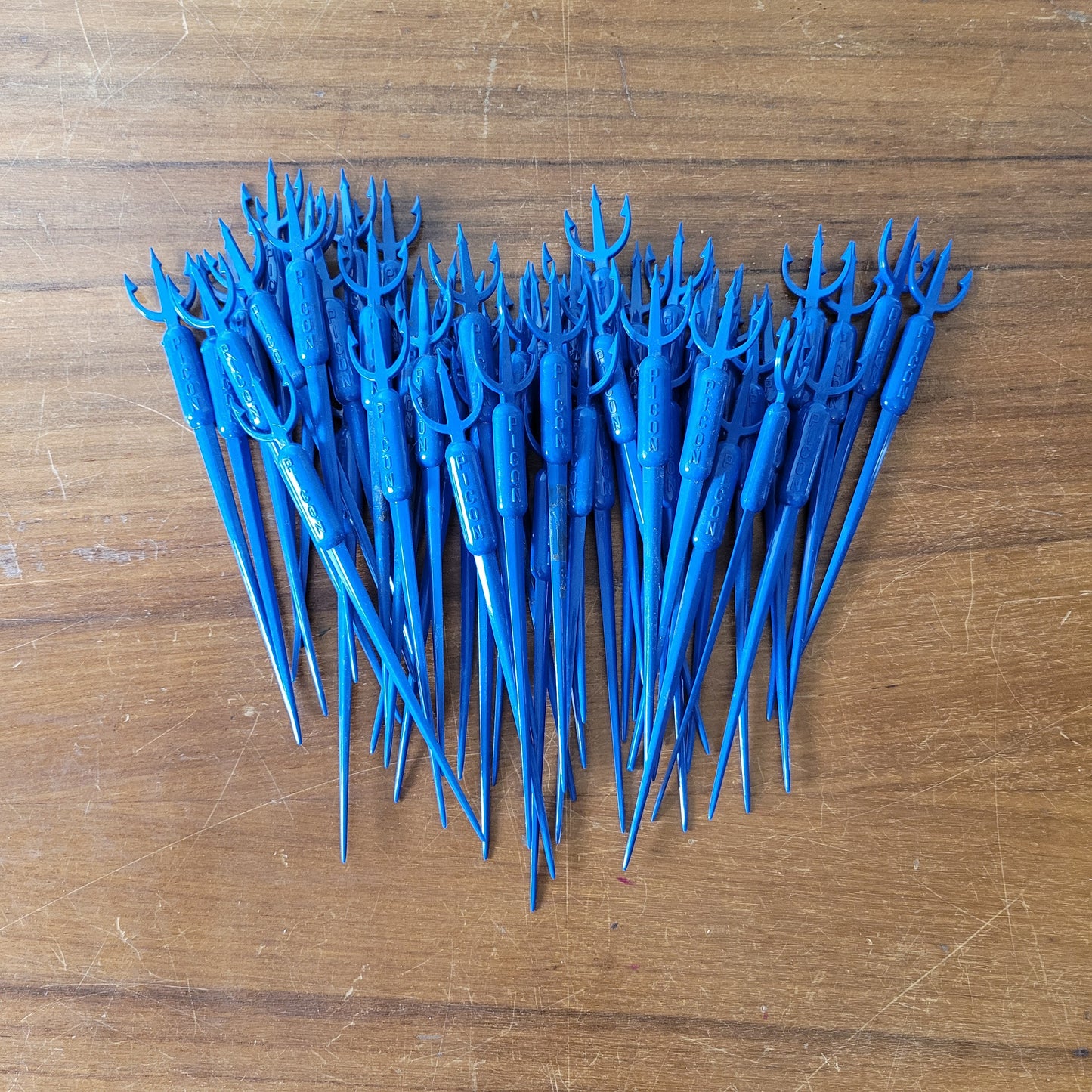 Vintage plastic trident cocktail stirrer, stamped PICON