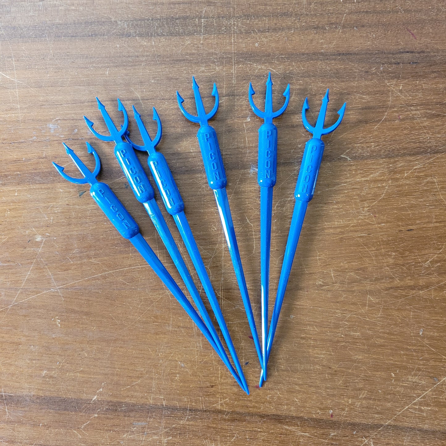 Vintage plastic trident cocktail stirrer, stamped PICON