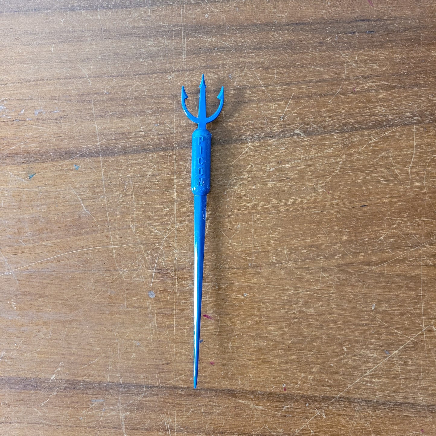 Vintage plastic trident cocktail stirrer, stamped PICON