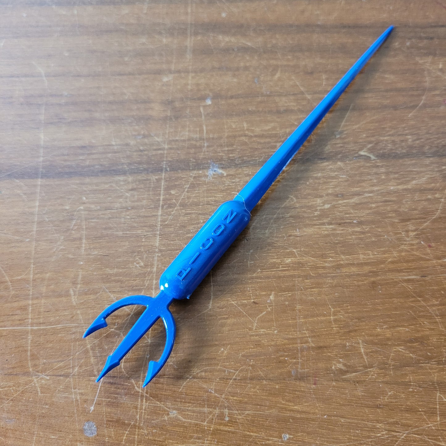 Vintage plastic trident cocktail stirrer, stamped PICON