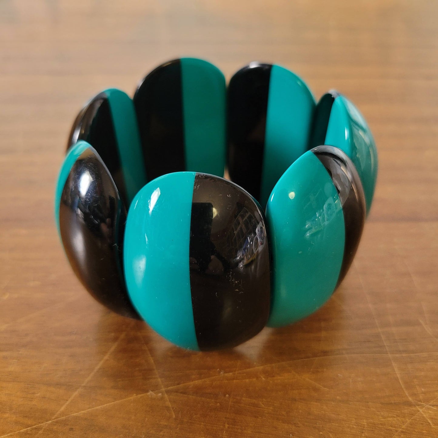 1980s-style statement two tone peacock green & black stretch bangle