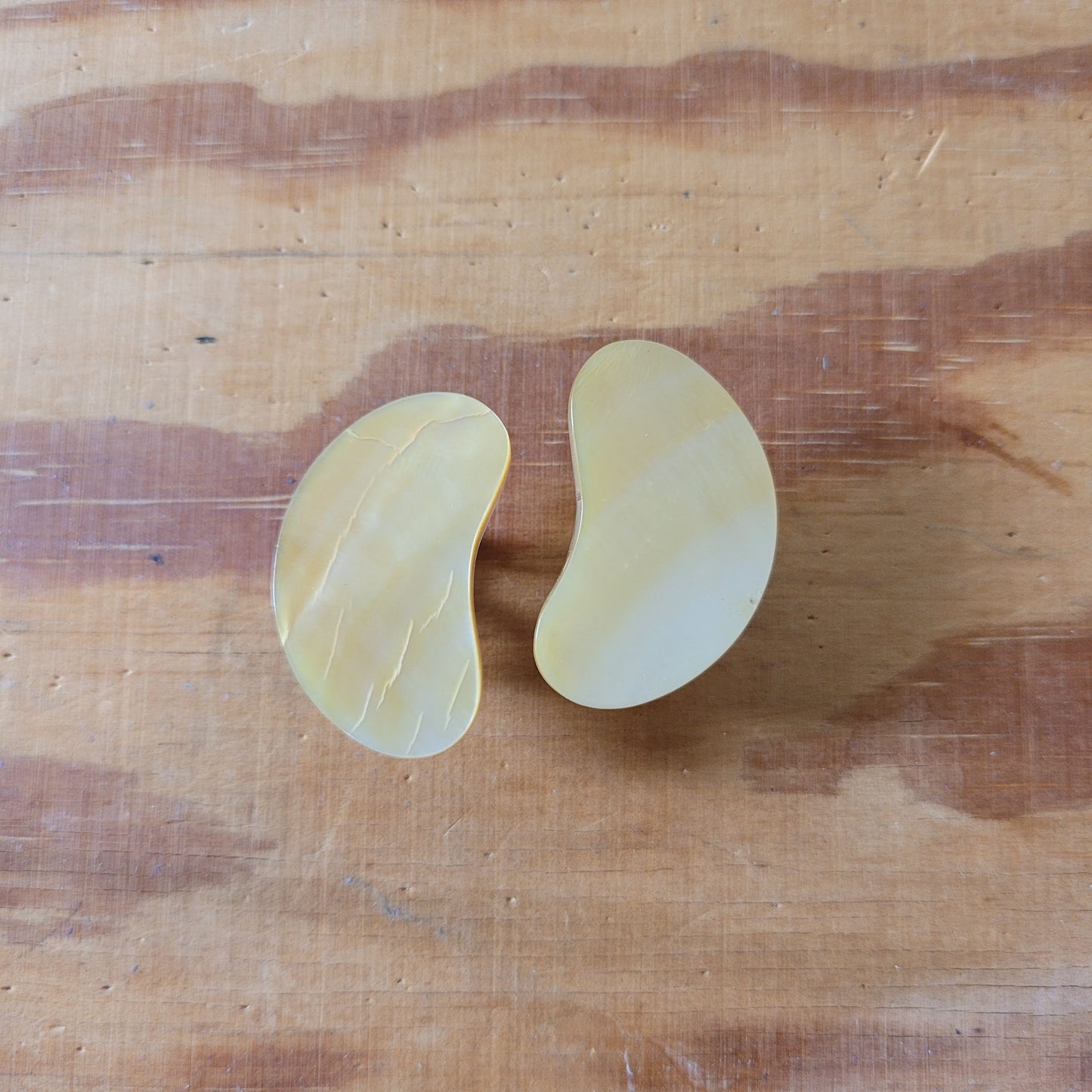 Large 1960s mother of pearl kidney bean shaped flat clip-on earrings
