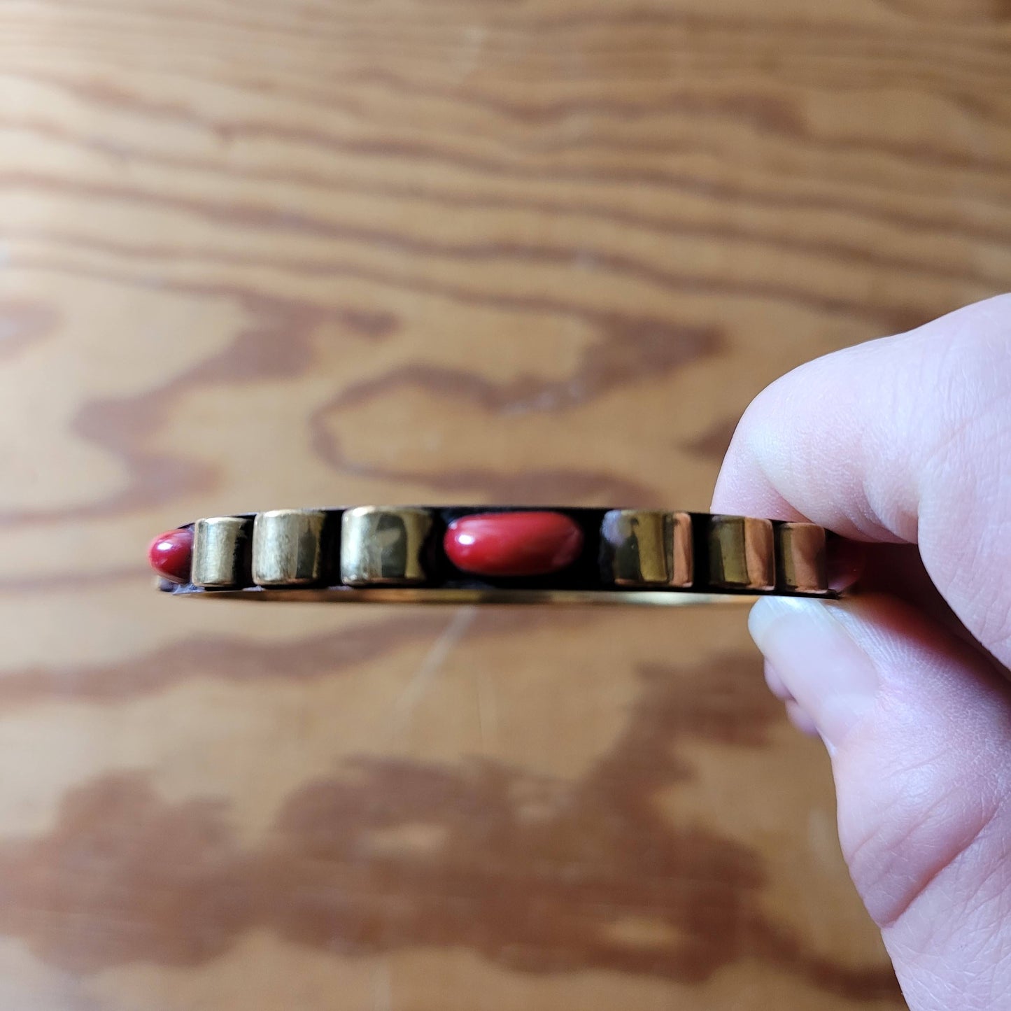 1970s/80s Moroccan-style brass bangle with red cabochon detail