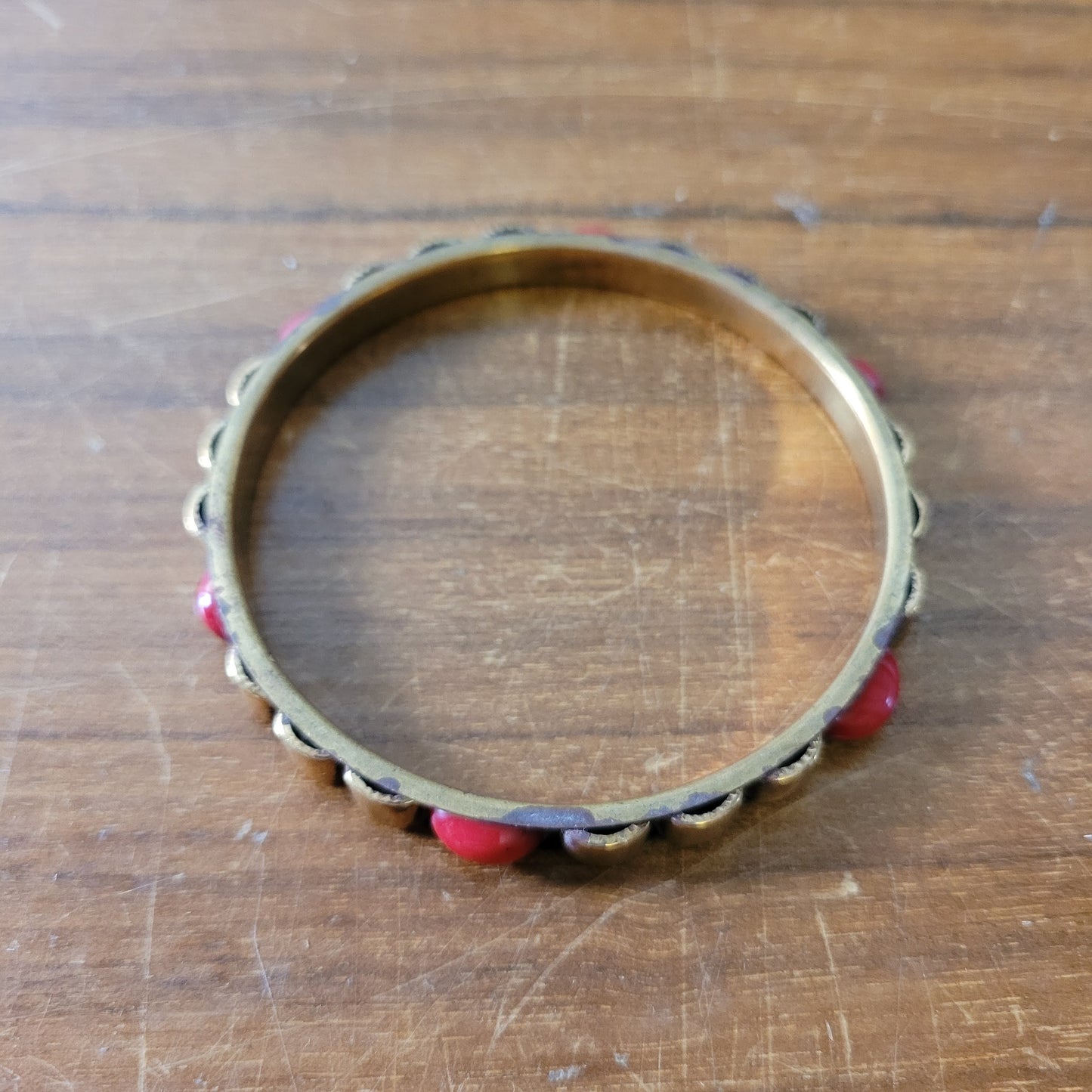 1970s/80s Moroccan-style brass bangle with red cabochon detail