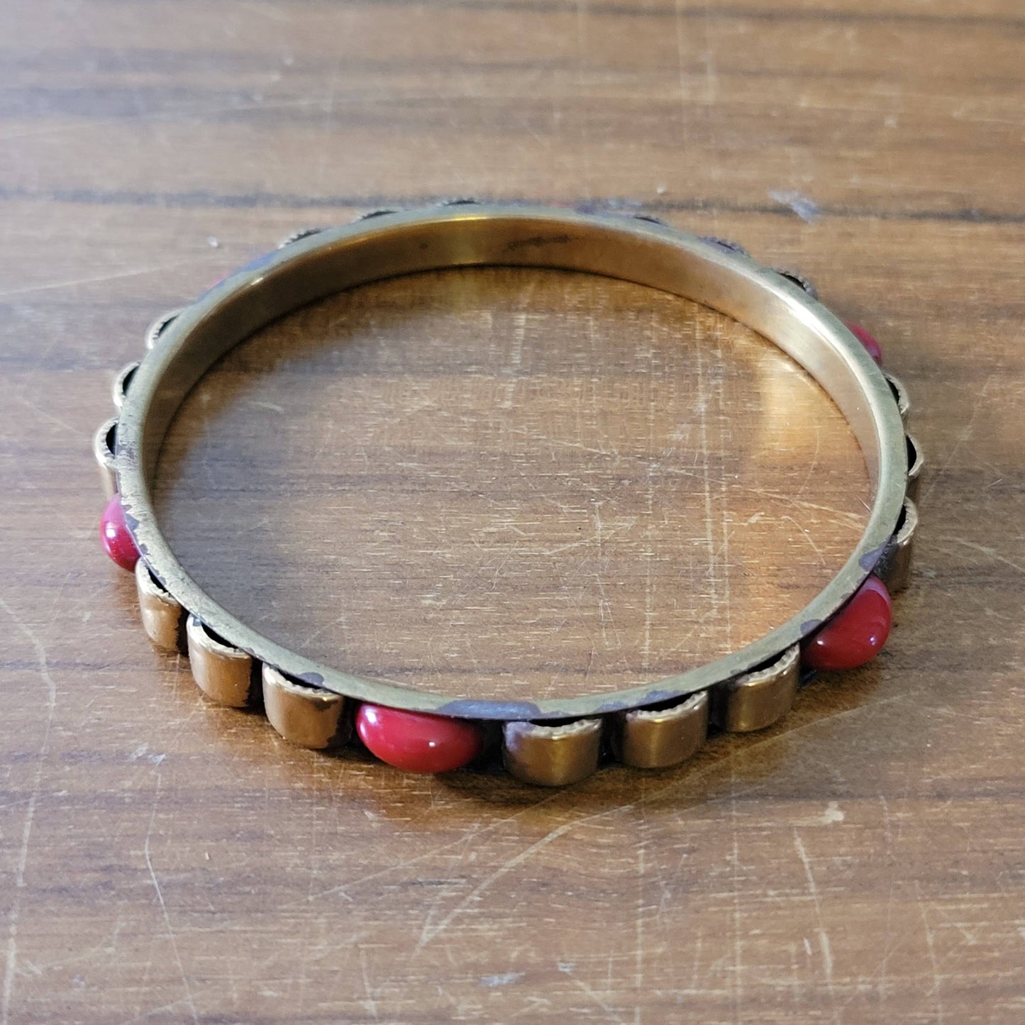 1970s/80s Moroccan-style brass bangle with red cabochon detail