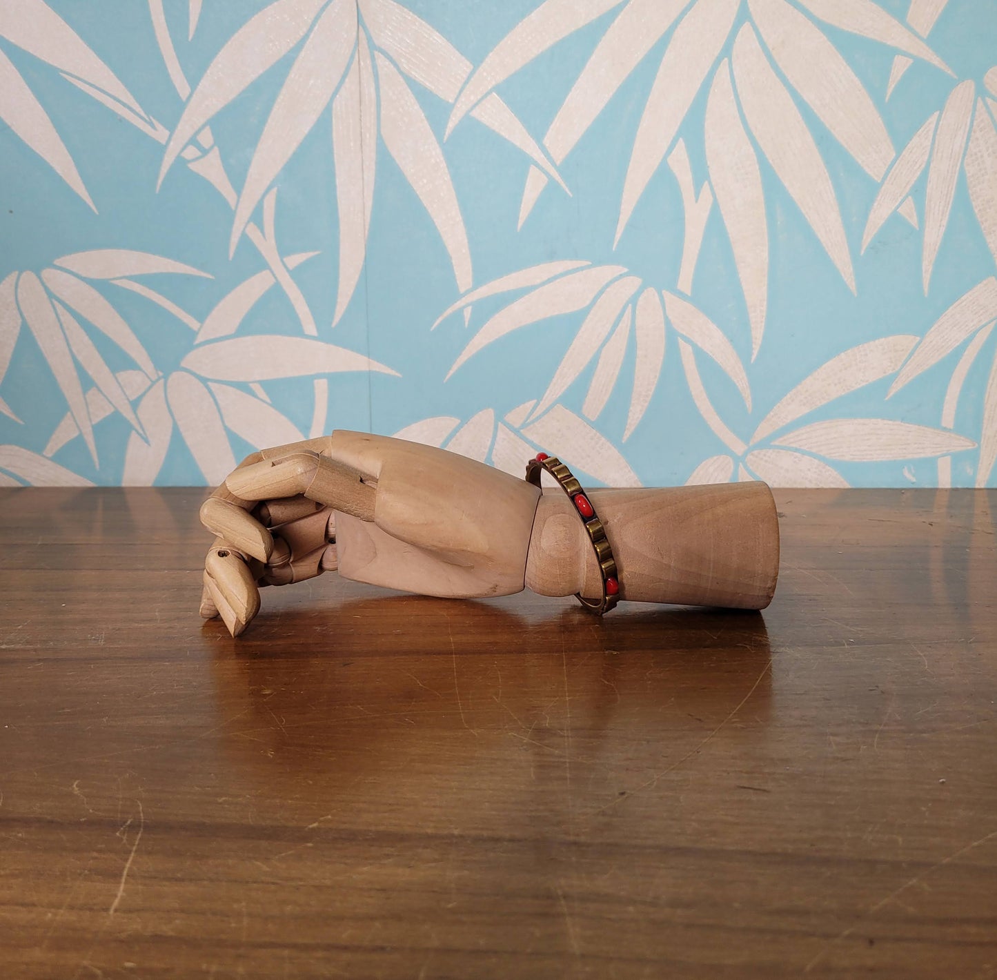 1970s/80s Moroccan-style brass bangle with red cabochon detail