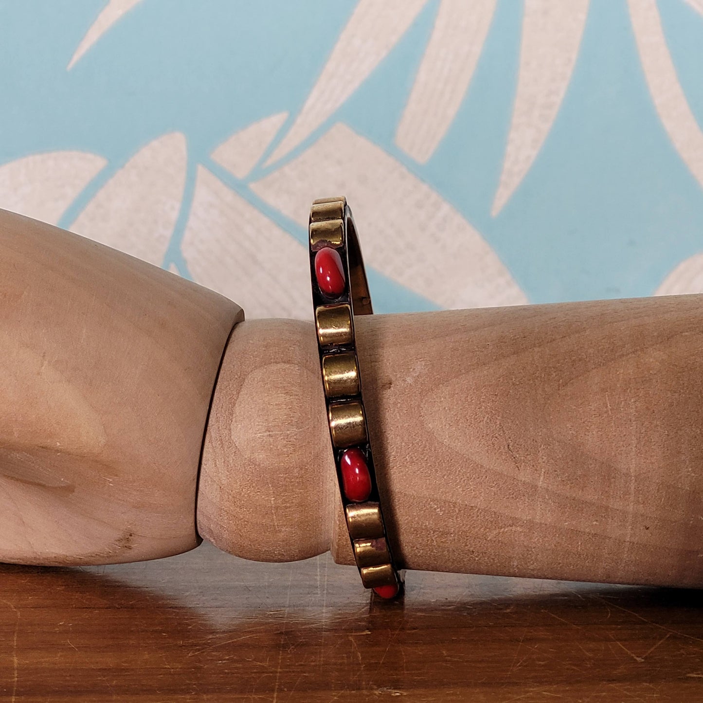 1970s/80s Moroccan-style brass bangle with red cabochon detail