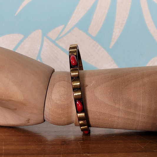 1970s/80s Moroccan-style brass bangle with red cabochon detail