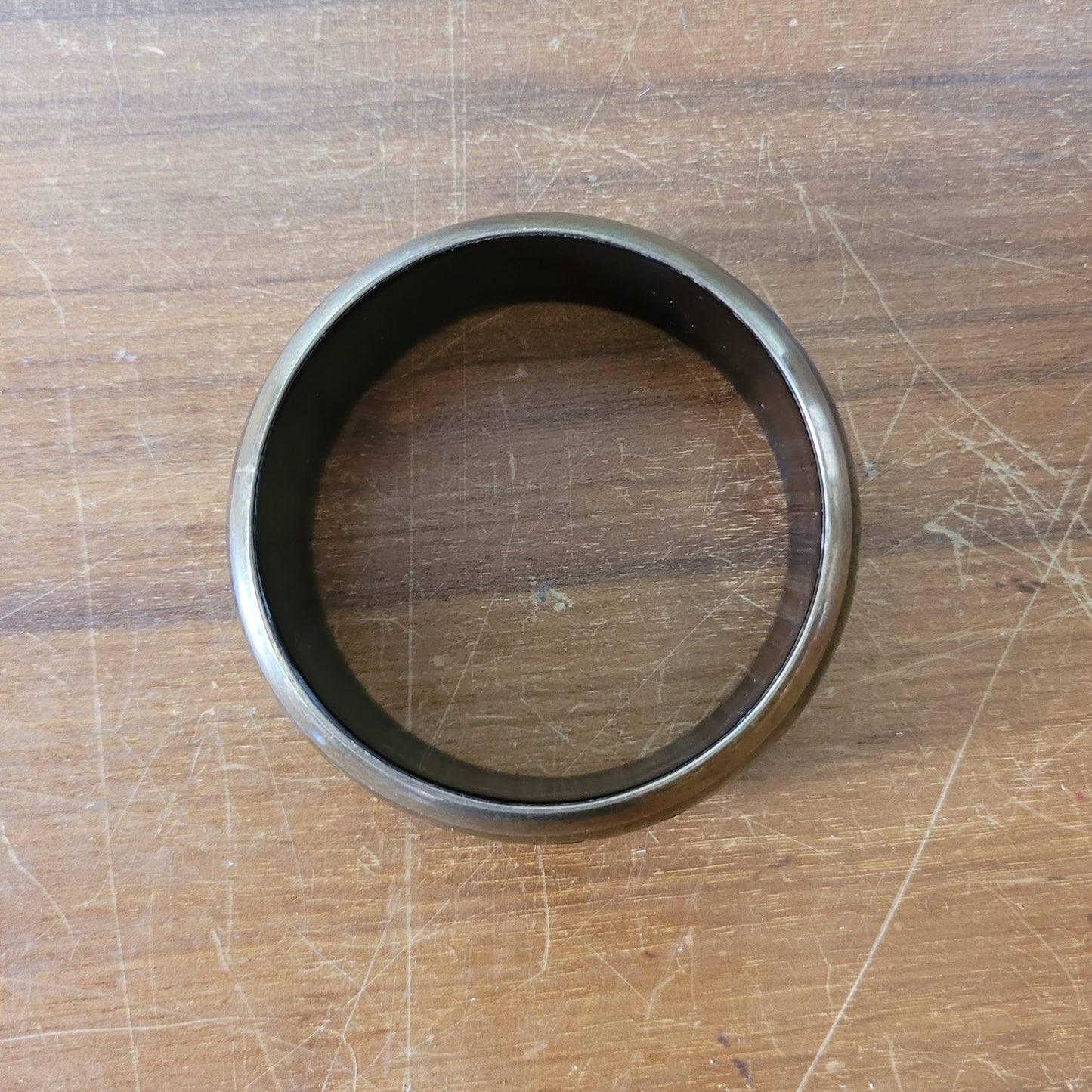 circa. 1980s postmodern black lacquered bangle with green brushstroke motif and brass trim