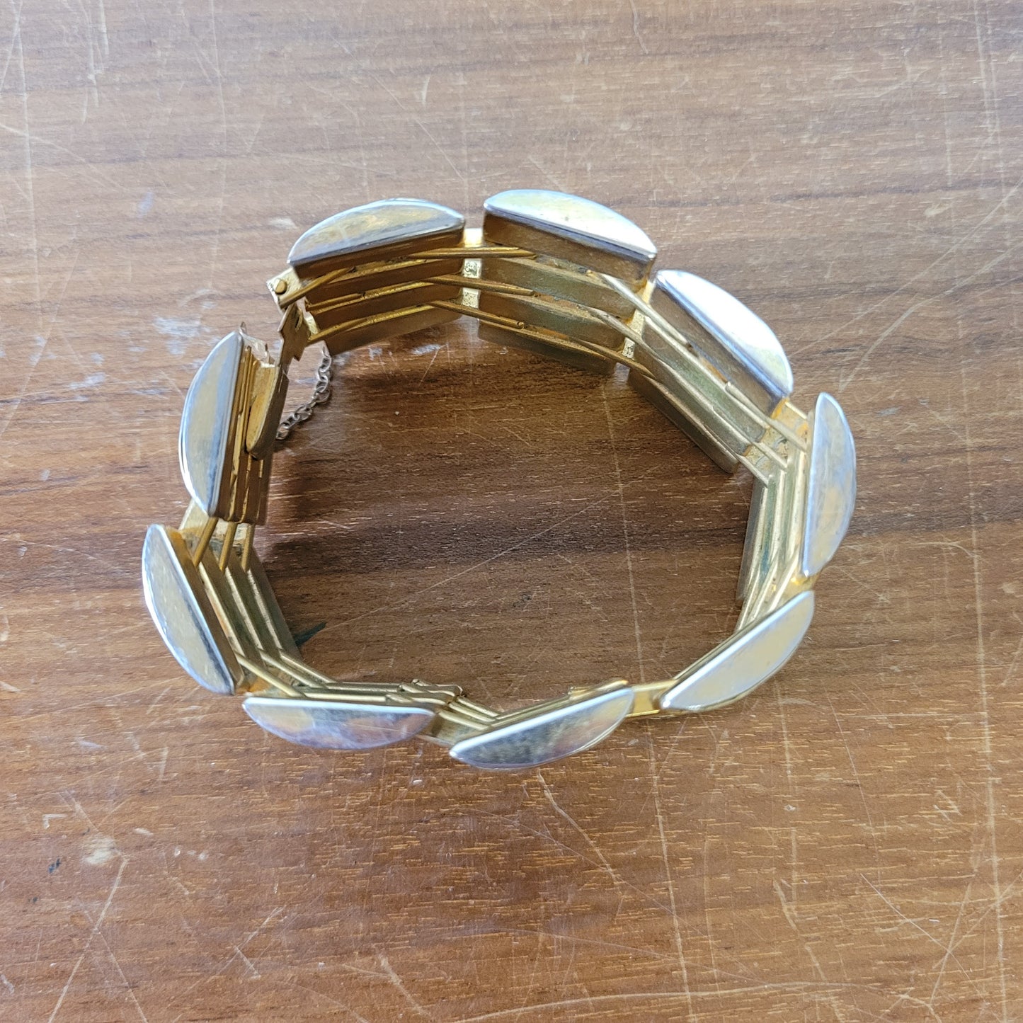 Vintage Damascene gold-tone four row tank bracelet with safety chain.