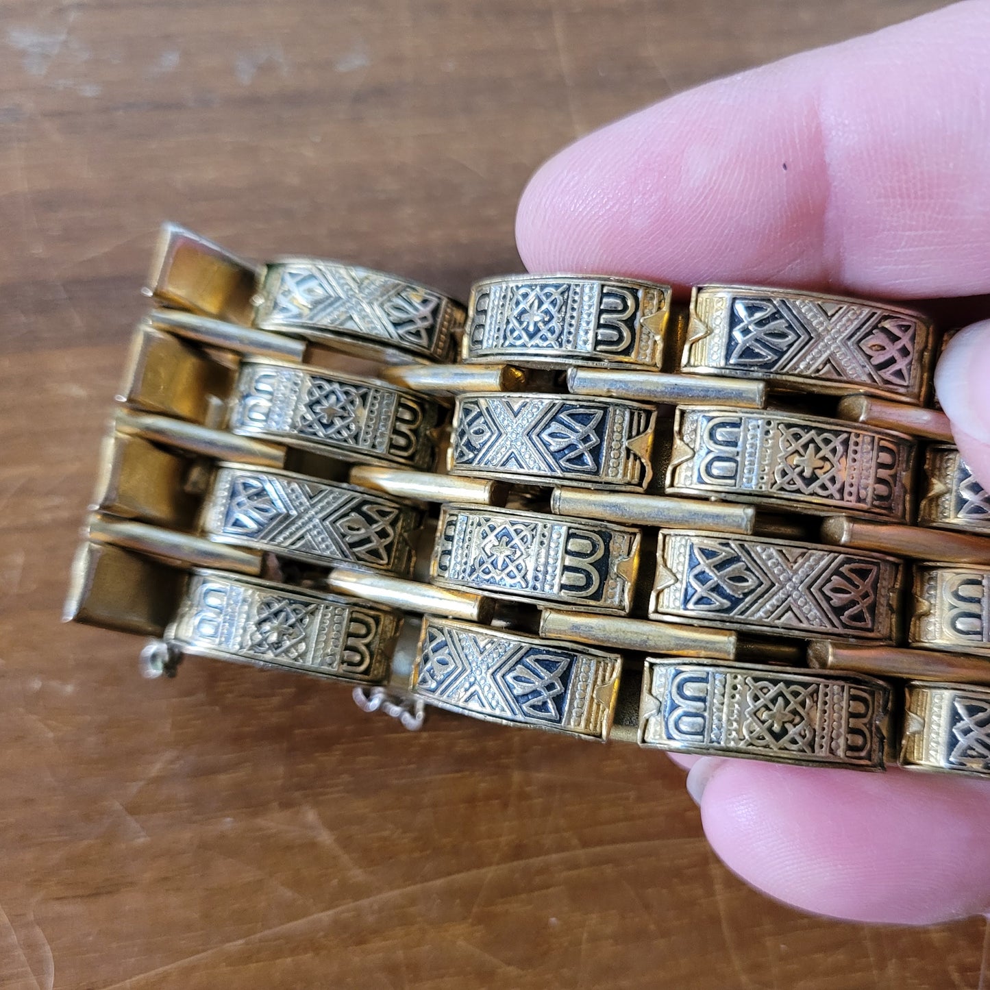 Vintage Damascene gold-tone four row tank bracelet with safety chain.